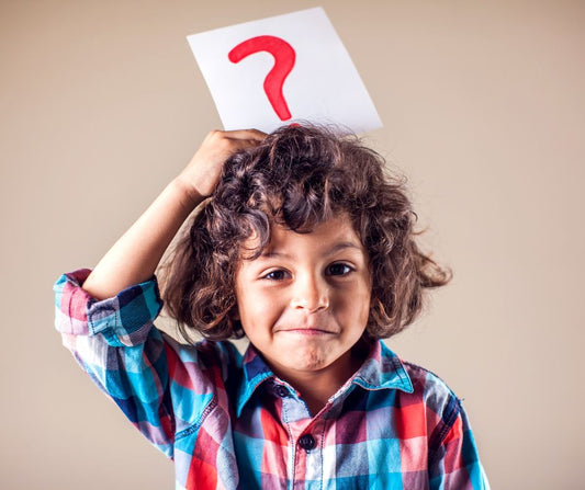 confused child with a ? above his head
